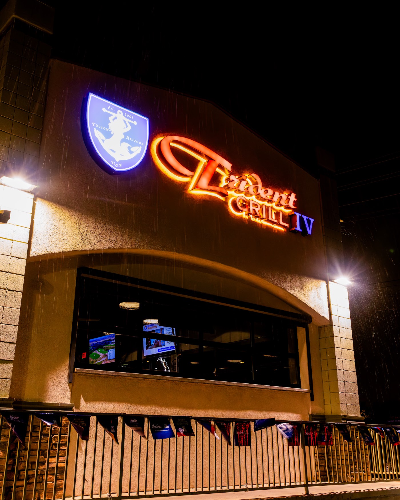Trident IV neon sign at night