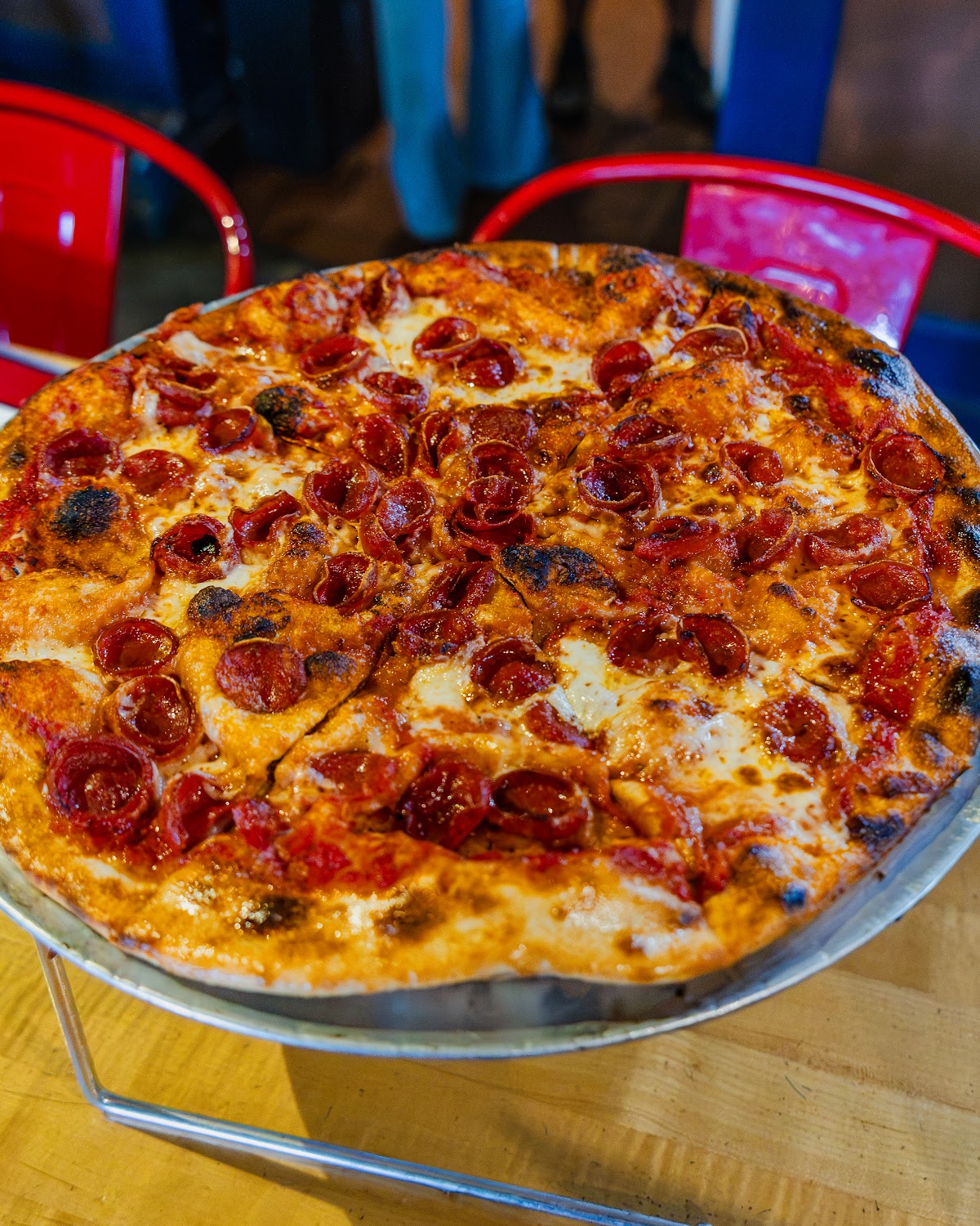 Pepperoni pizza on a stand