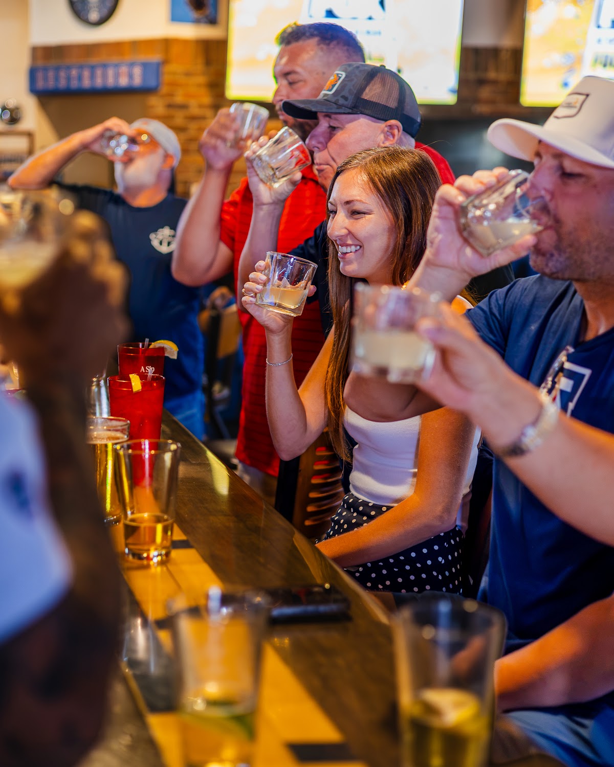 Friends doing shots at the Pizza Pub bar